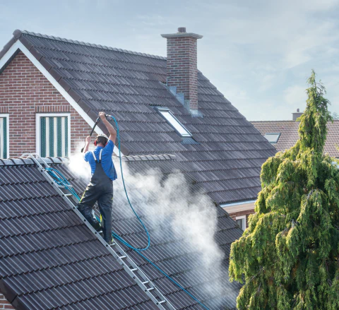 worker doing roof cleaning